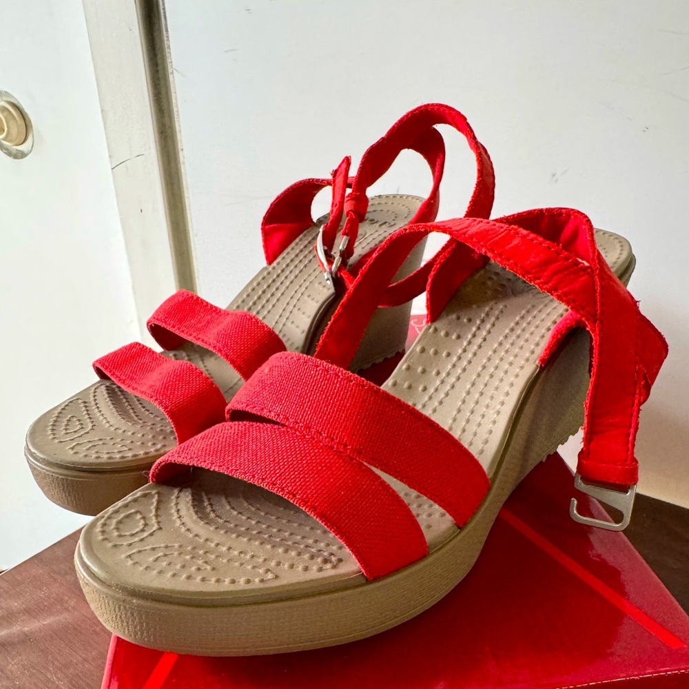 Red strappy wedge Crocs sandals